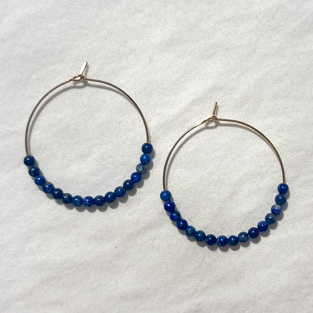 large gold-filled hoops with lapis lazuli