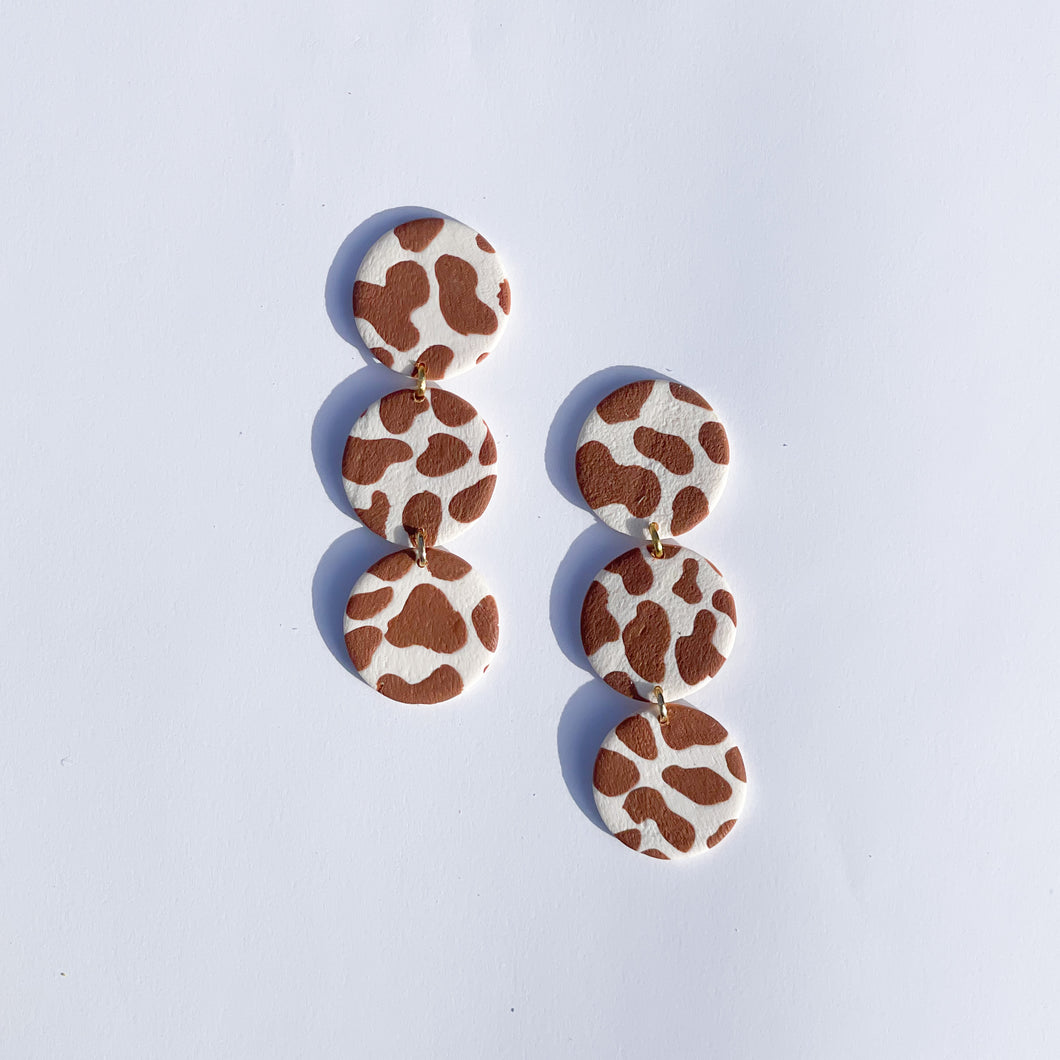 light brown cow print three circle dangles