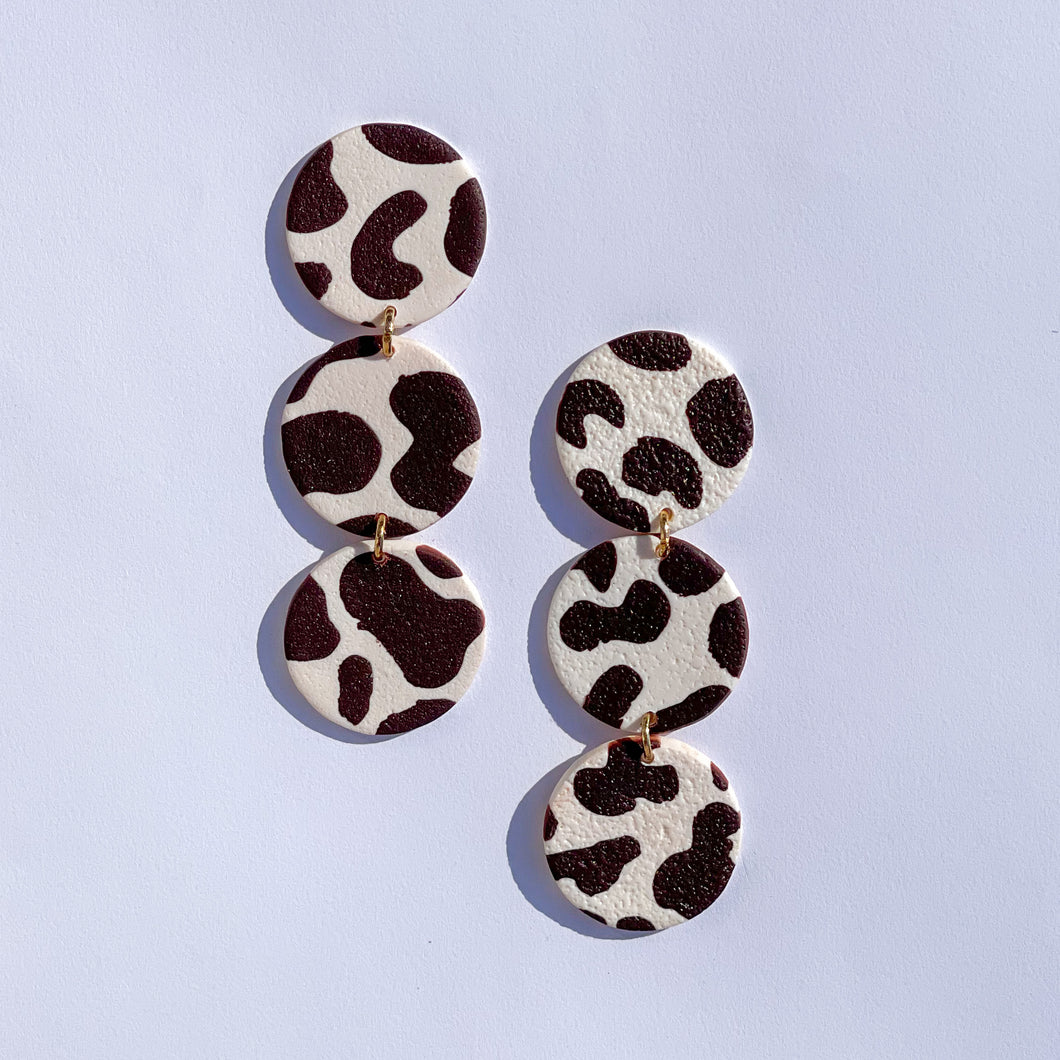 dark brown cow print dangles