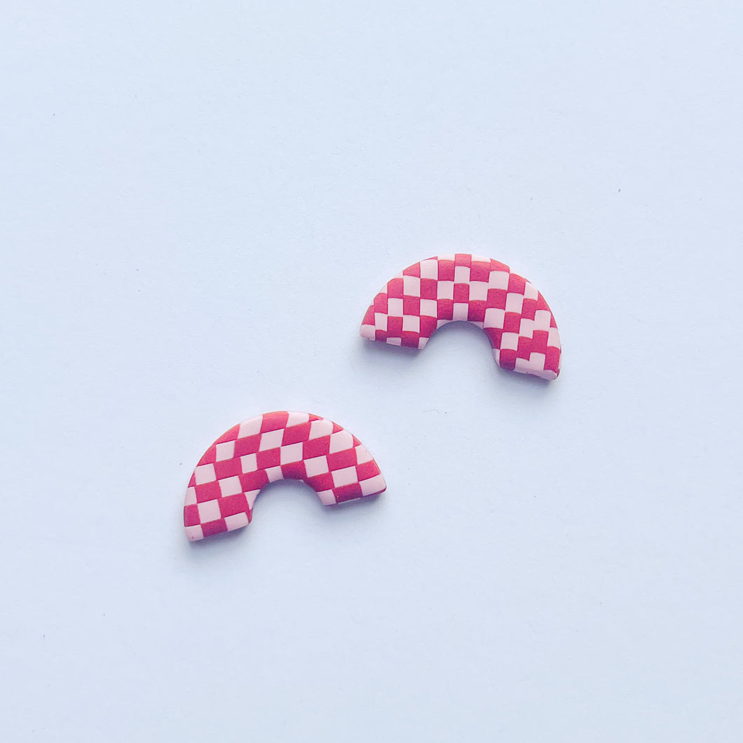 pink and red checkerboard studs