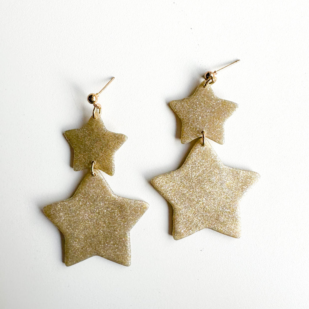 gold glittery double star dangles